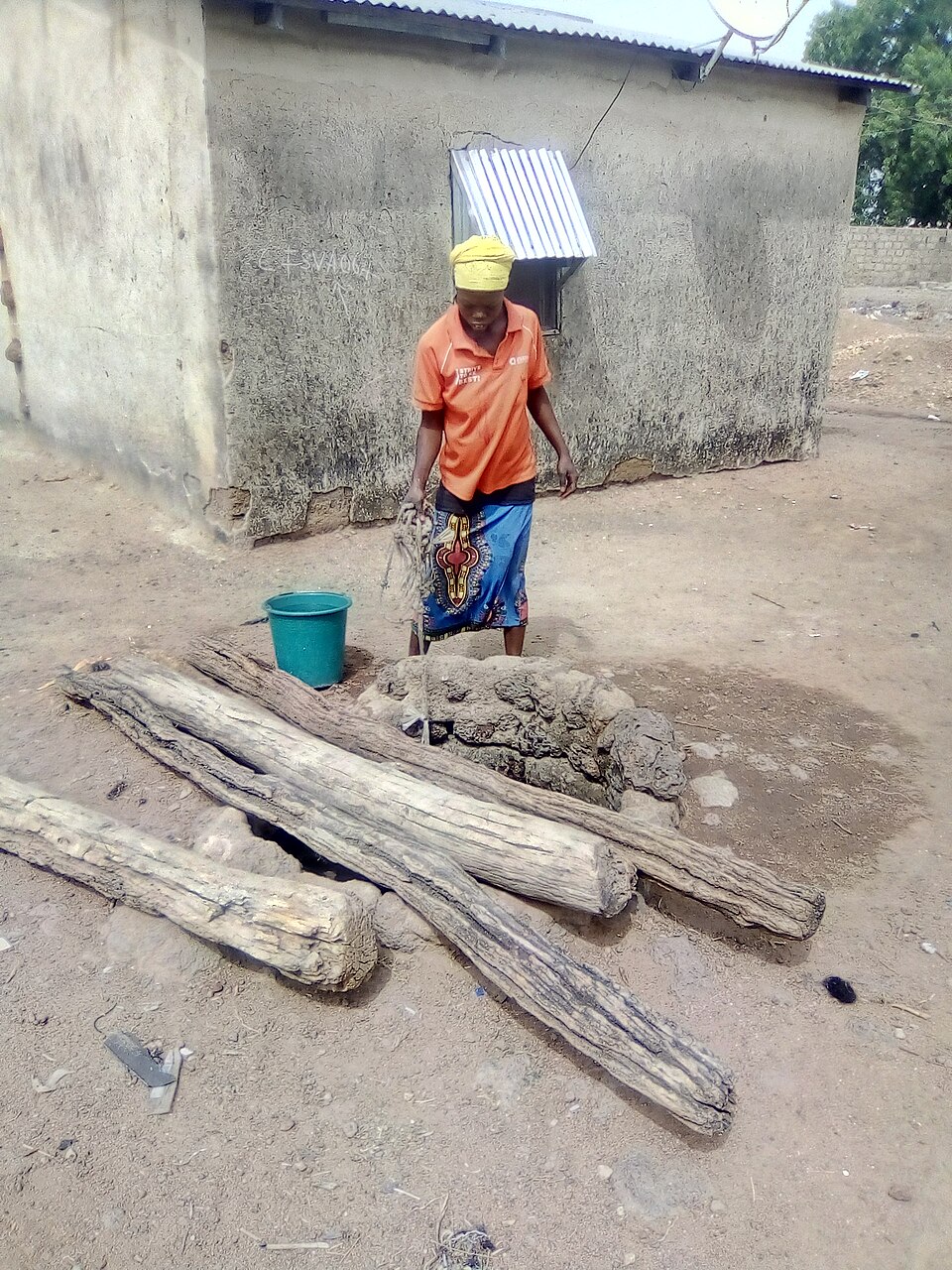 A woman fetching water from a borehole in Northern Ghana