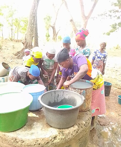 Women fetching water from a well in Northern Ghana
